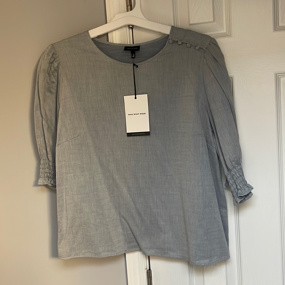 Denim blouse.